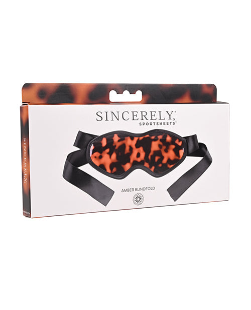 Atentamente, Amber Blindfold