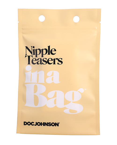 Stimulateurs de mamelons Doc Johnson dans un sac